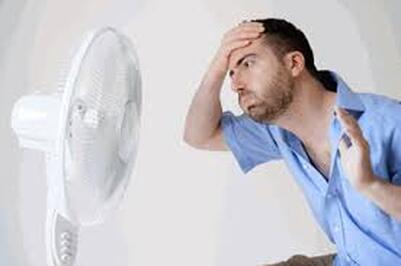 Man overheating needs furnace repair